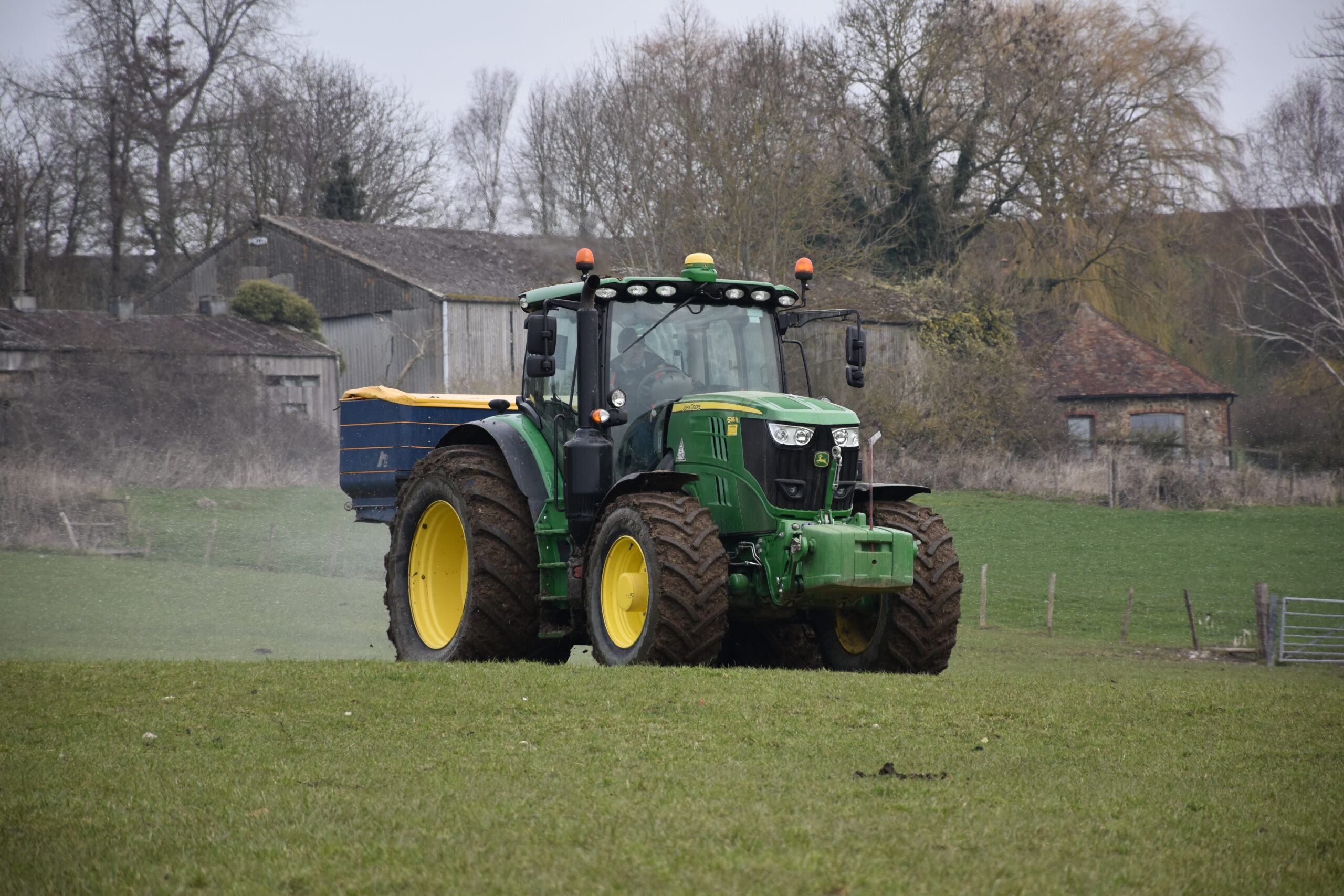 John Deere tractor fertiliser spreading